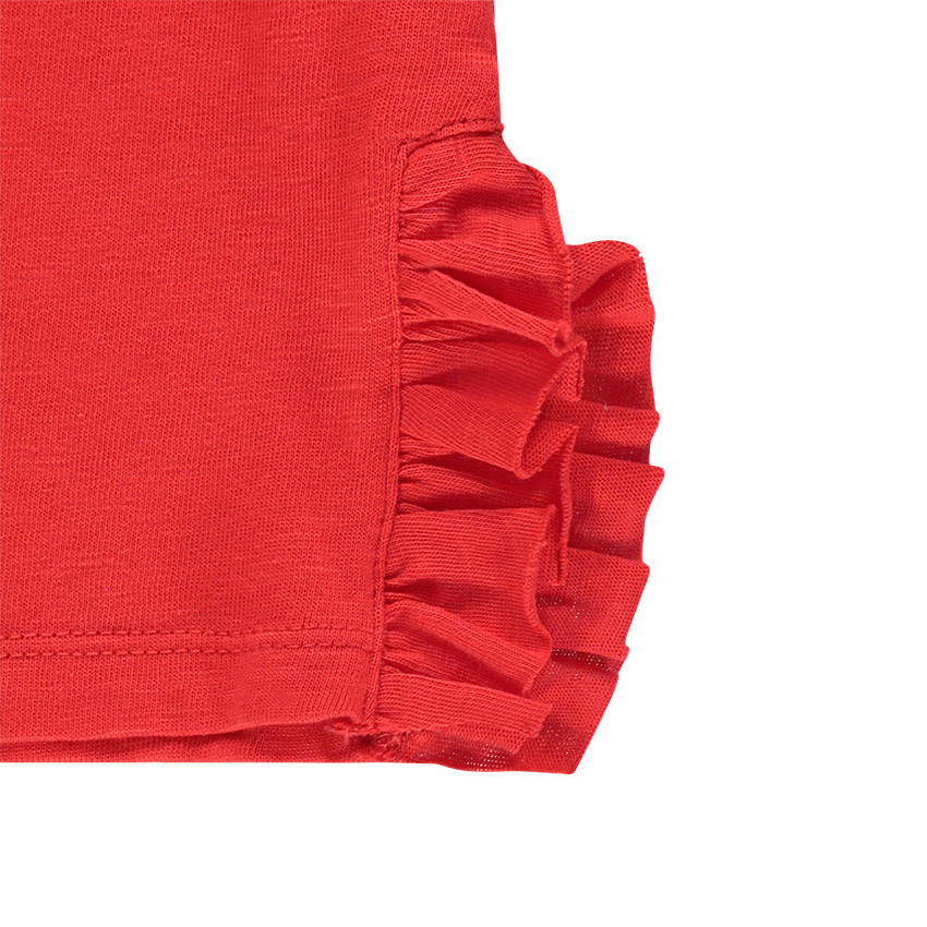 Μακρυμάνικη μπλούζα με βολάν και φουντίτσες κάτω από διχτυωτή φάσα 