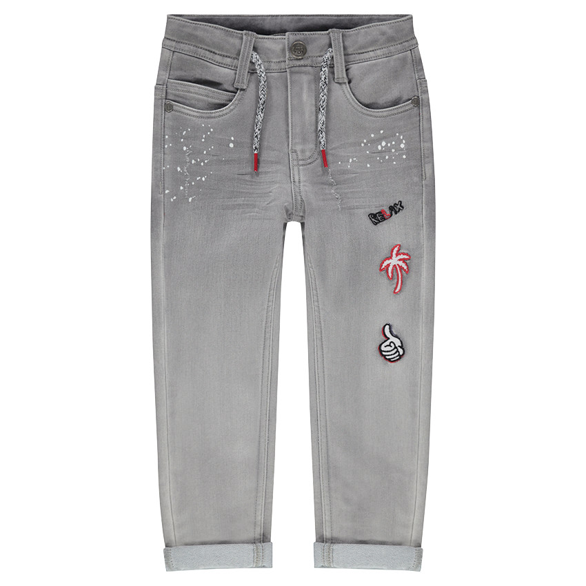 Τζιν με used όψη, τυπωμένες κηλίδες χρώματος και απλικέ σήματα 