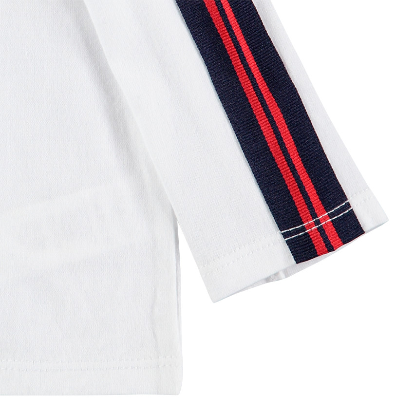 Σύνολο μονόχρωμο πόλο και σαλοπέτα με όψη ντένιμ και κεντημένη μαϊμού 